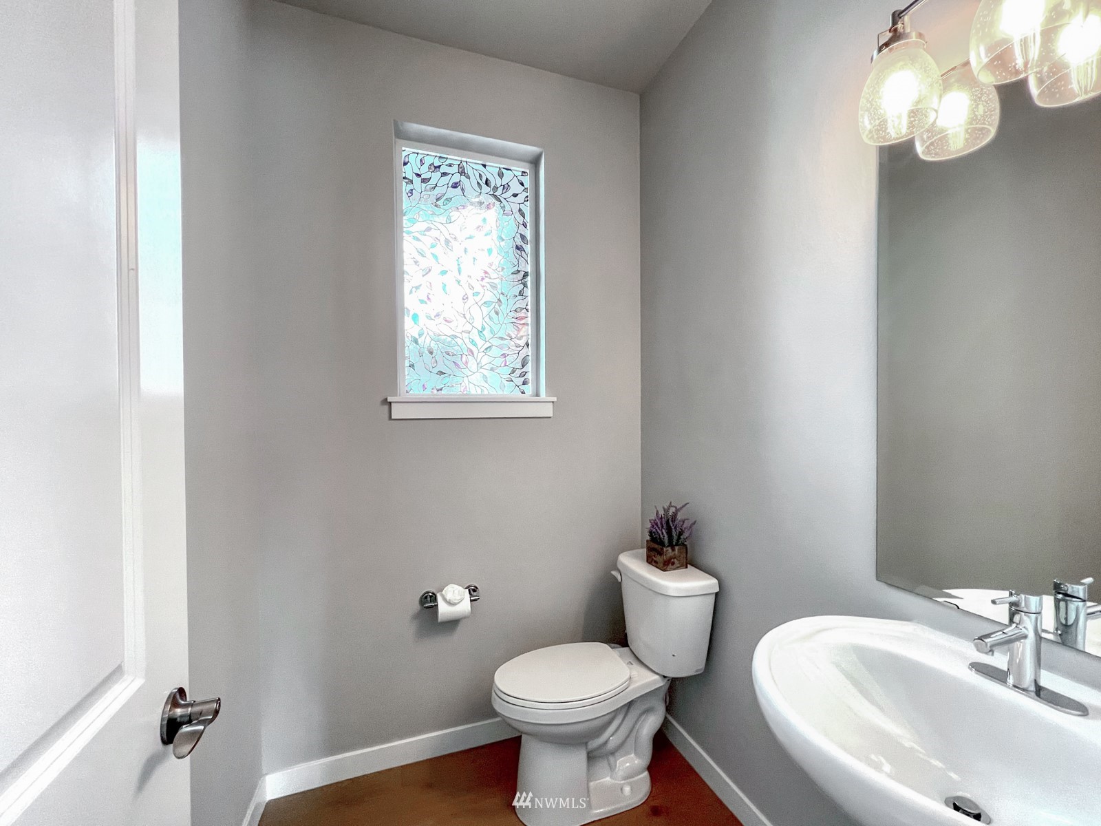 509 237th Place Southeast, Unit E Bothell, WA 98021 - Photo 14 of 35 a bathroom with a toilet sink and mirror