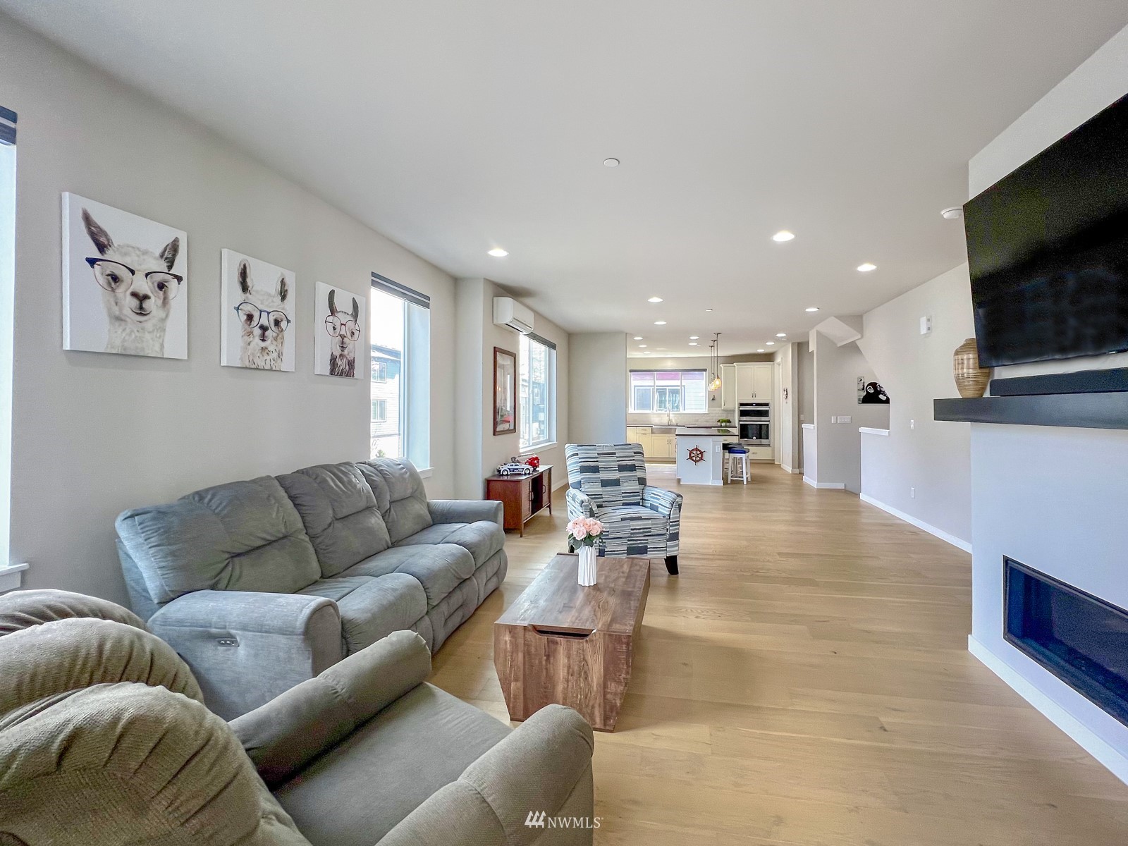 509 237th Place Southeast, Unit E Bothell, WA 98021 - Photo 16 of 35 a living room with furniture and a flat screen tv