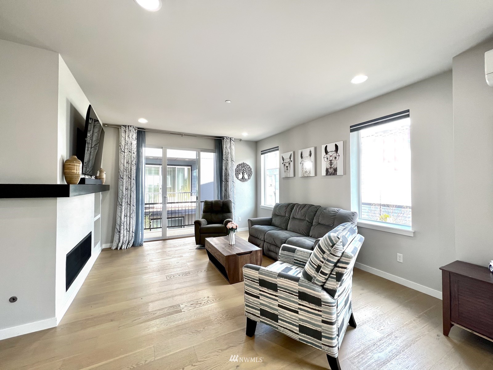 509 237th Place Southeast, Unit E Bothell, WA 98021 - Photo 18 of 35 a living room with furniture and a flat screen tv