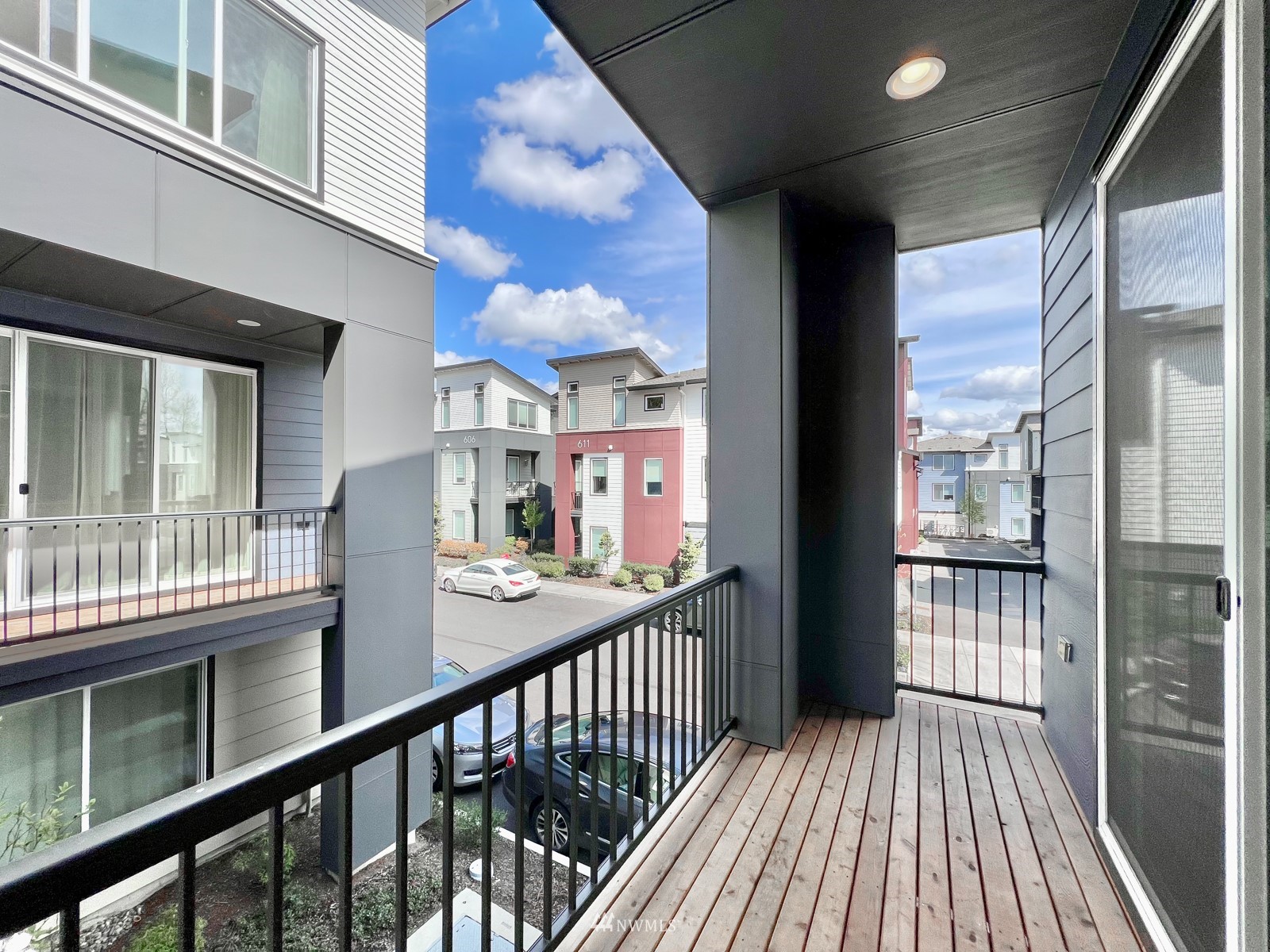 509 237th Place Southeast, Unit E Bothell, WA 98021 - Photo 21 of 35 a view of a balcony with wooden floor
