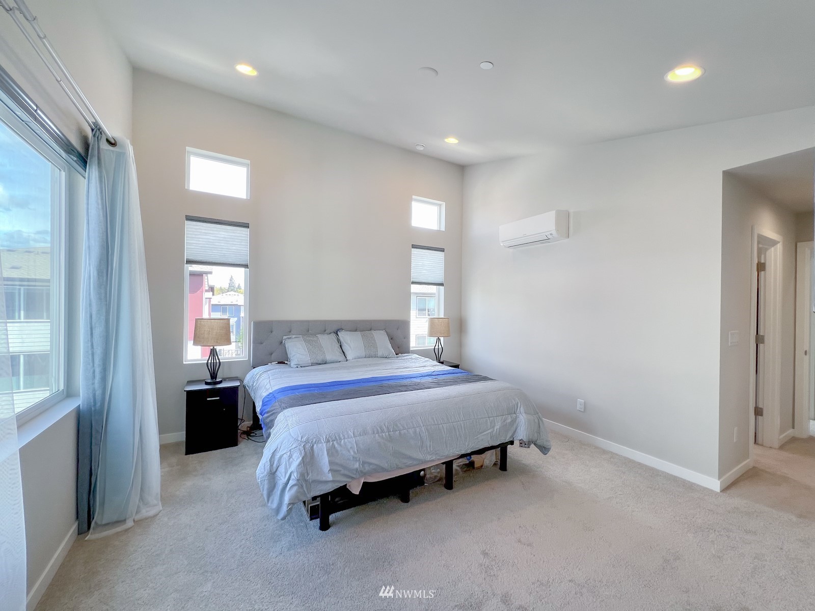 509 237th Place Southeast, Unit E Bothell, WA 98021 - Photo 27 of 35 a spacious bedroom with a bed and window