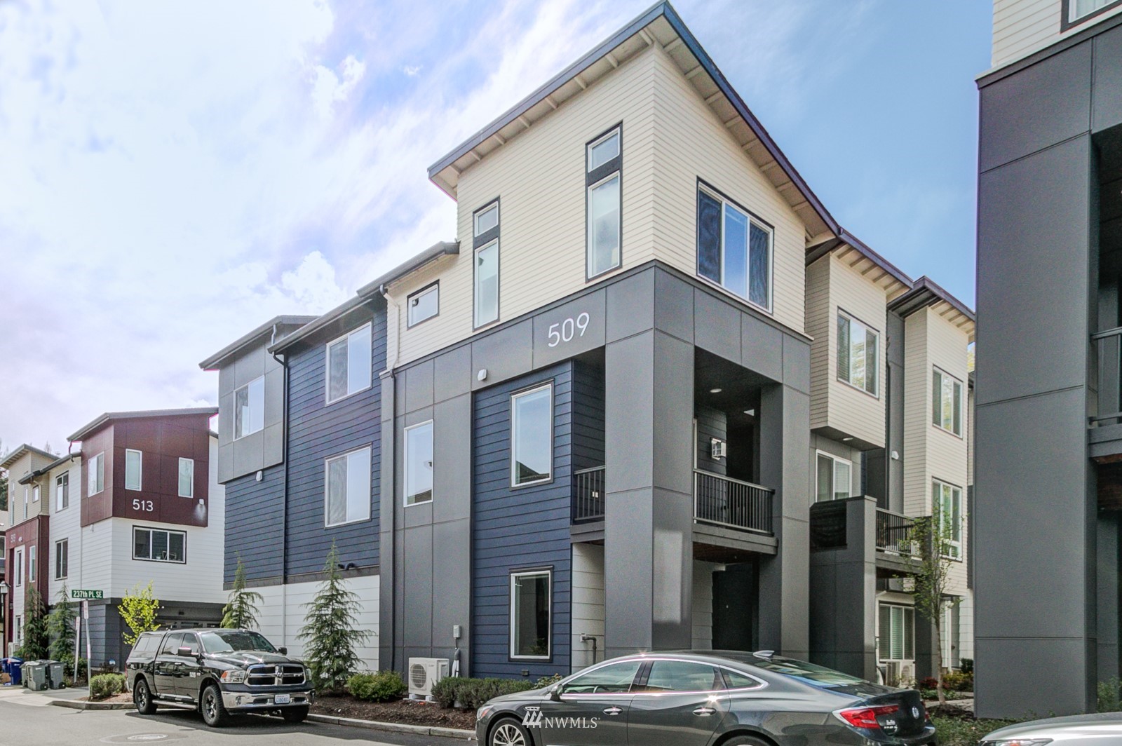 509 237th Place Southeast, Unit E Bothell, WA 98021 - Photo 3 of 35 a front view of a building with street