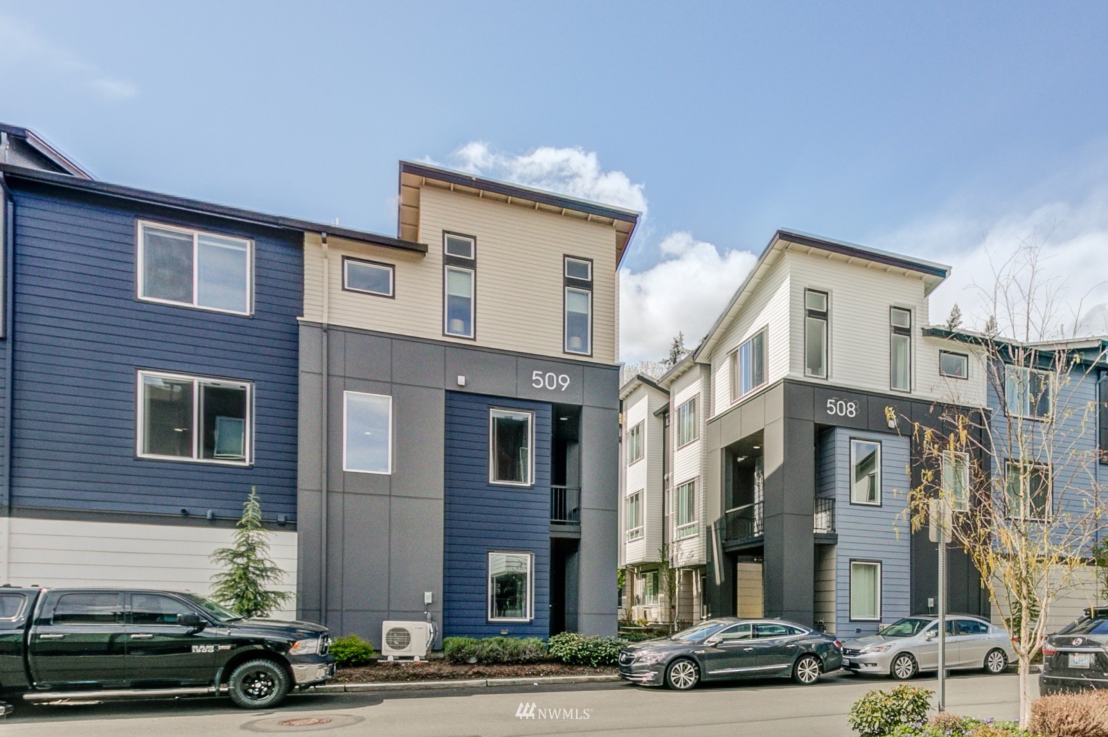 509 237th Place Southeast, Unit E Bothell, WA 98021 - Photo 4 of 35 a front view of a building with street view