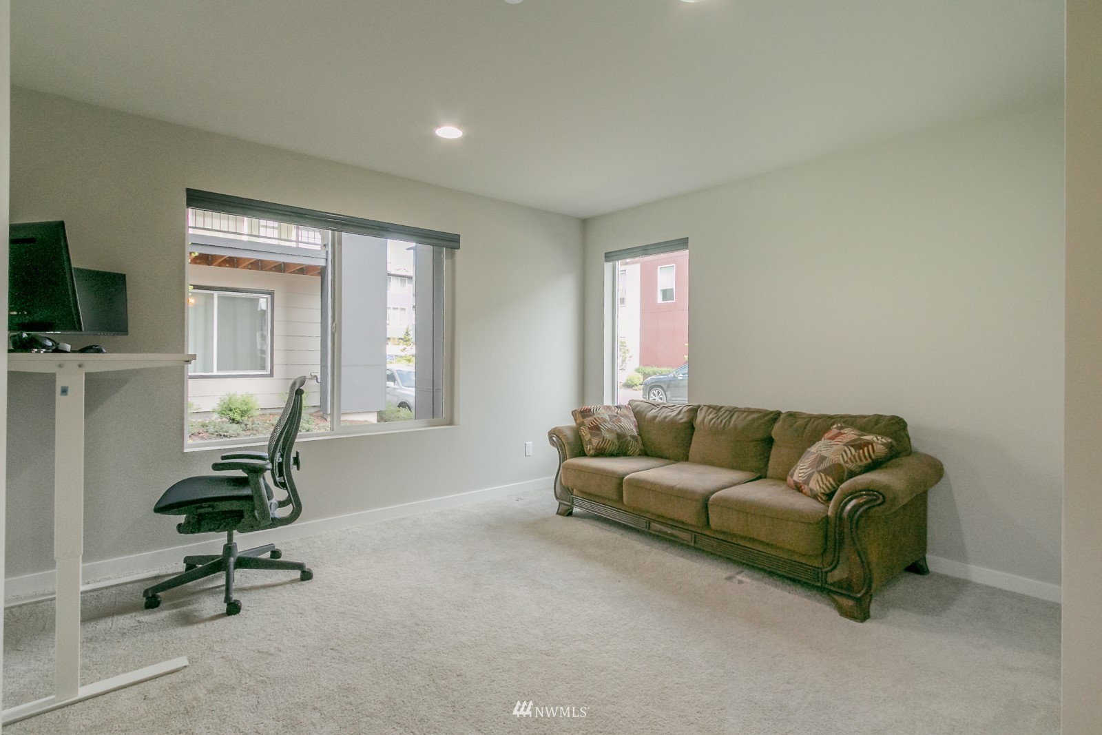 509 237th Place Southeast, Unit E Bothell, WA 98021 - Photo 7 of 35 a living room with furniture and a window