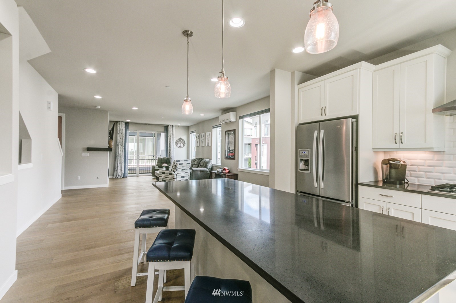509 237th Place Southeast, Unit E Bothell, WA 98021 - Photo 10 of 35 a large kitchen with stainless steel appliances lots of counter space and a refrigerator