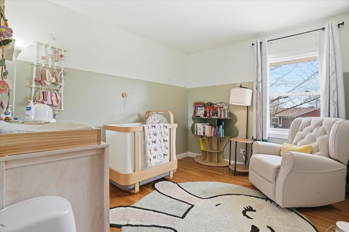 394 Northgate Road Lindenhurst, IL 60046 - Photo 17 of 28 a living room with furniture a rug and a large window