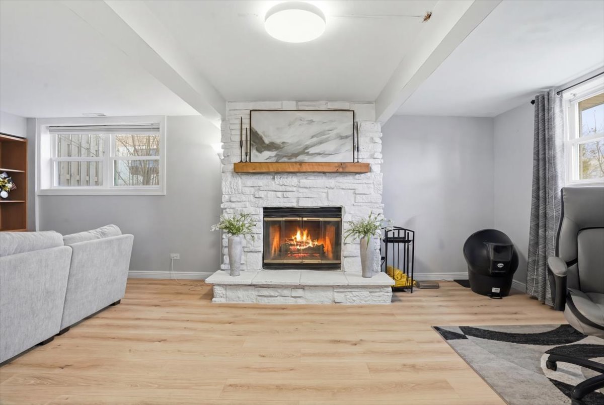 394 Northgate Road Lindenhurst, IL 60046 - Photo 21 of 28 a living room with furniture and a fireplace