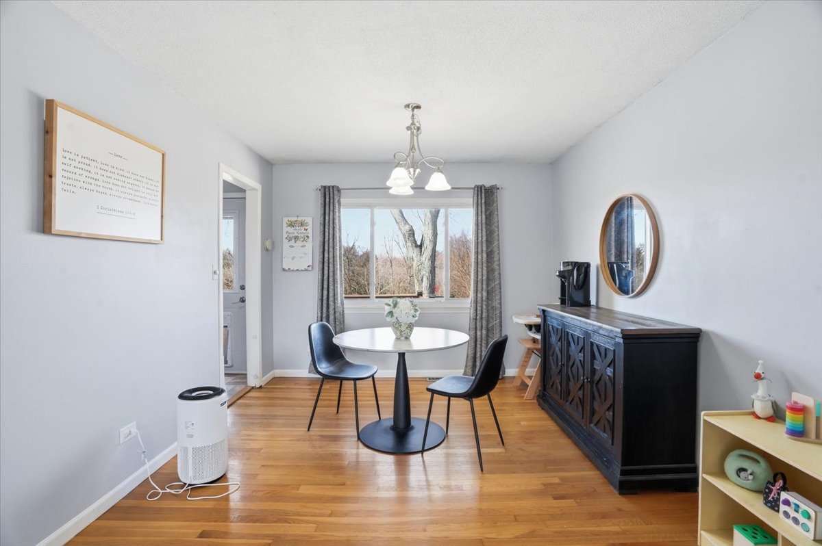 394 Northgate Road Lindenhurst, IL 60046 - Photo 7 of 28 a living room with furniture and a wooden floor