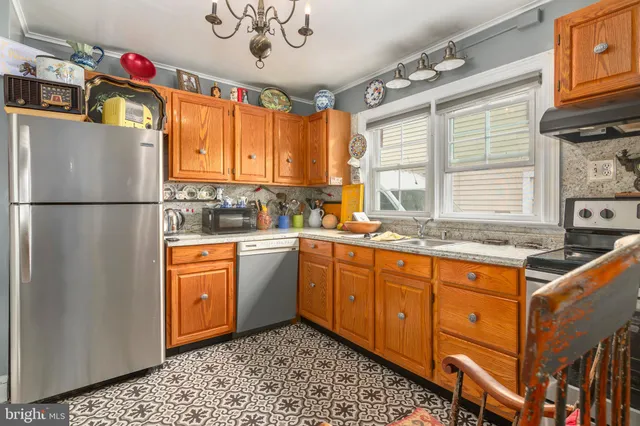 a living room with furniture and a book shelf