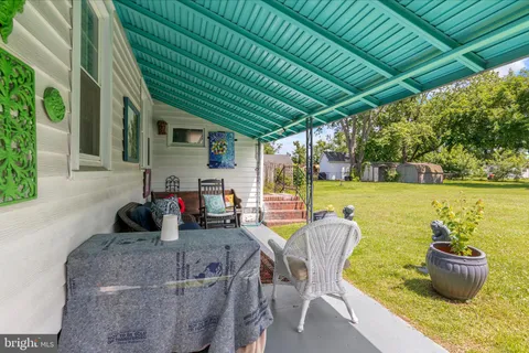a living room with furniture and a garden