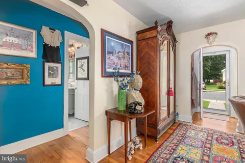 a view of an entryway with wooden floor