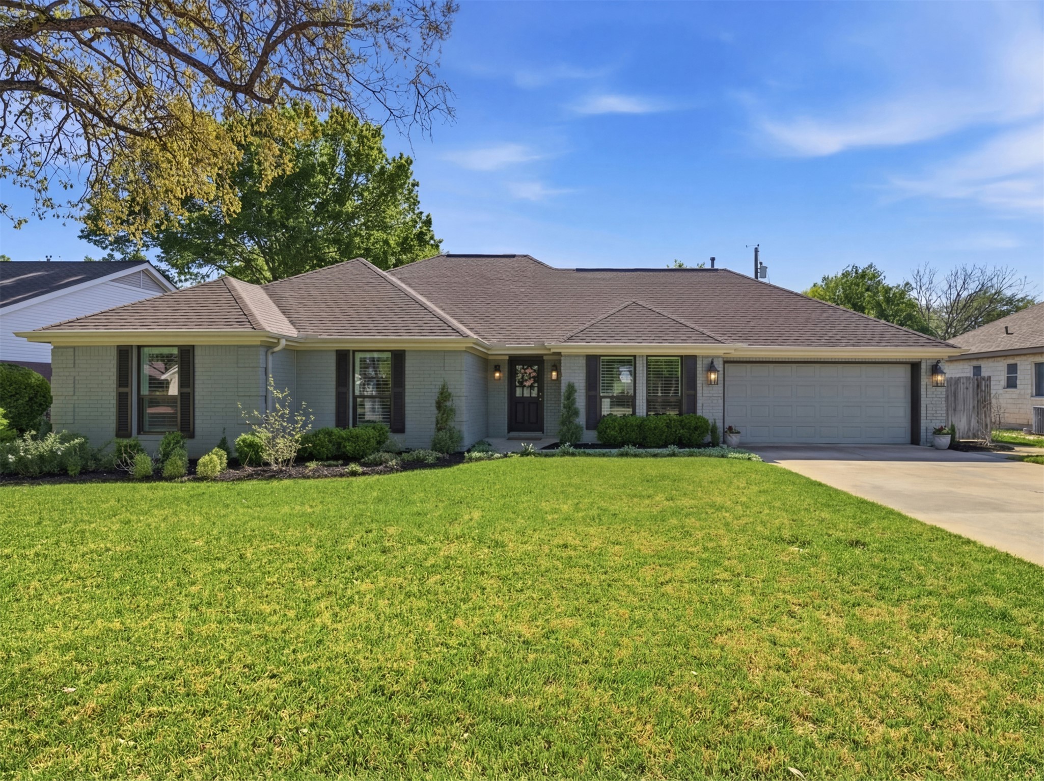 2810 Brandy Lane Georgetown, TX 78628 - Photo 1 of 38 a front view of a house with a garden