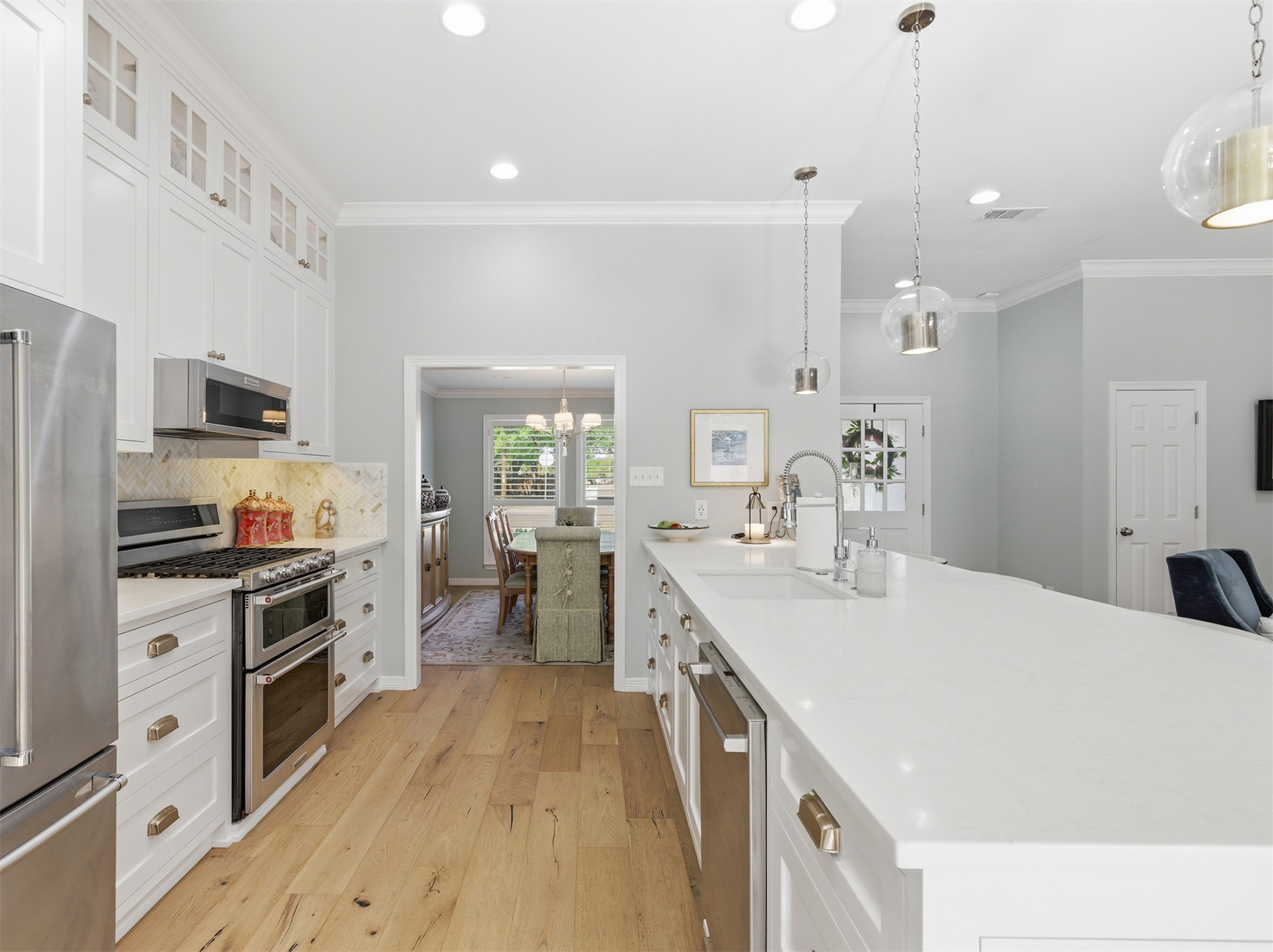2810 Brandy Lane Georgetown, TX 78628 - Photo 11 of 38 a large white kitchen with a stove top oven a sink a counter space and cabinets