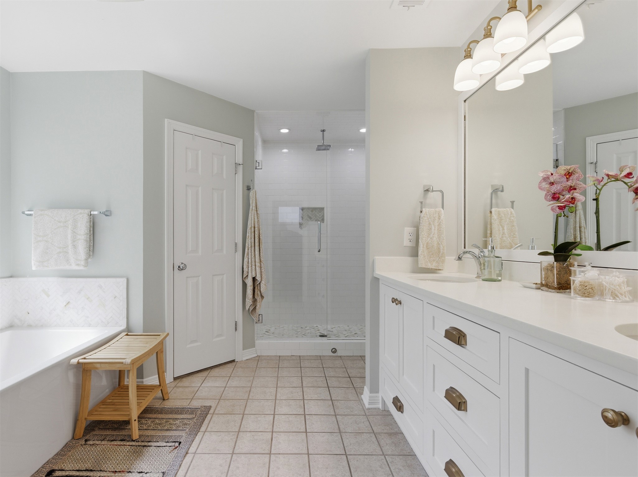 2810 Brandy Lane Georgetown, TX 78628 - Photo 19 of 38 a spacious bathroom with a double vanity sink a mirror and a shower
