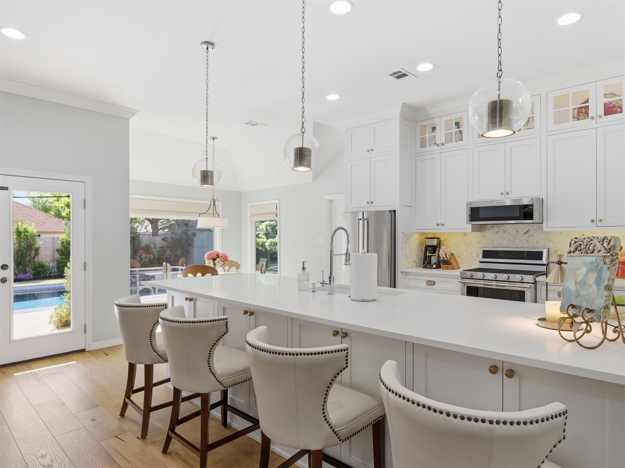 2810 Brandy Lane Georgetown, TX 78628 - Photo 8 of 38 a kitchen with stainless steel appliances a kitchen island a stove a sink a dining table and chairs