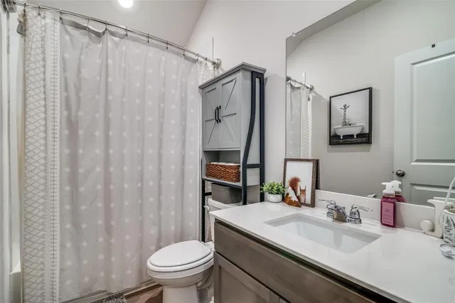 a view of room with workspace and windows