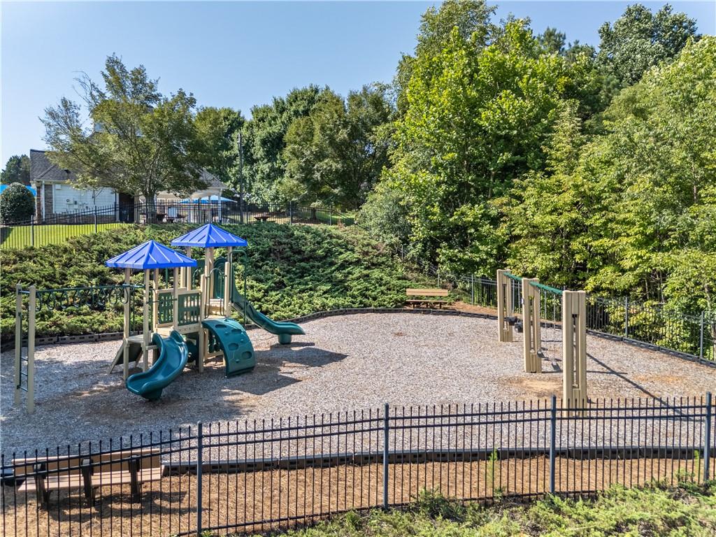 665 Roxford Lane Northeast Buford, GA 30518 - Photo 18 of 19 swimming pool view with a seating space