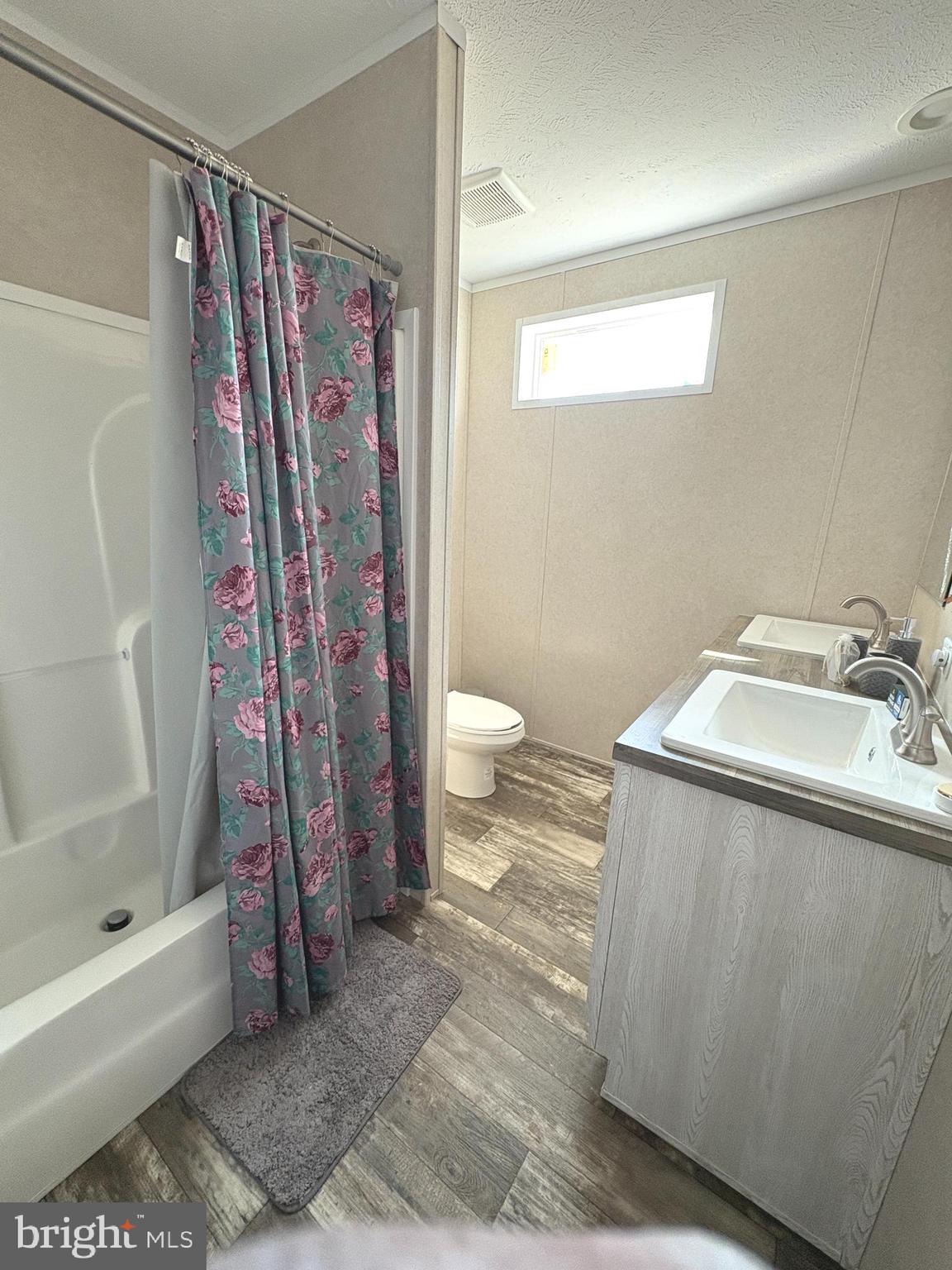 8236 Camden Road Port Royal, VA 22535 - Photo 14 of 14 a bathroom with a sink a toilet and a shower