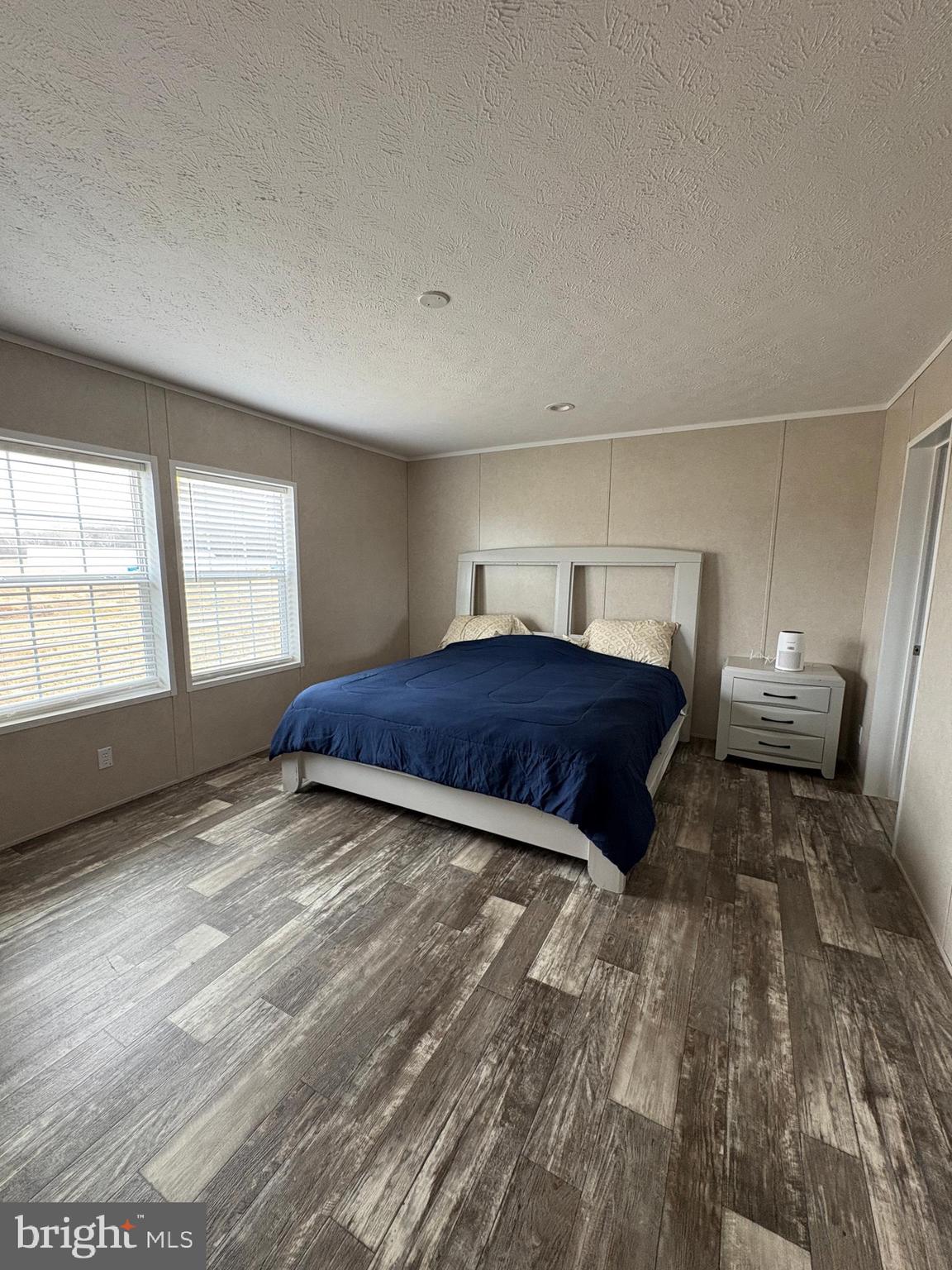 8236 Camden Road Port Royal, VA 22535 - Photo 9 of 14 a living room with a bed furniture and a large window