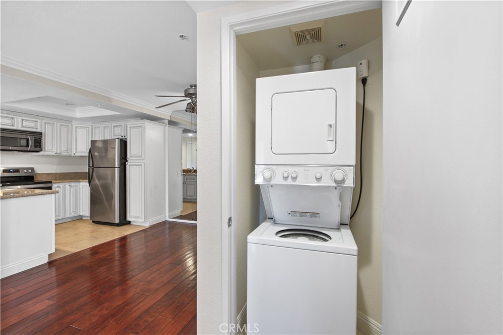 2800 Keller Drive, Unit 30 Tustin, CA 92782 - Photo 3 of 9 a view of washer and dryer with wooden floor