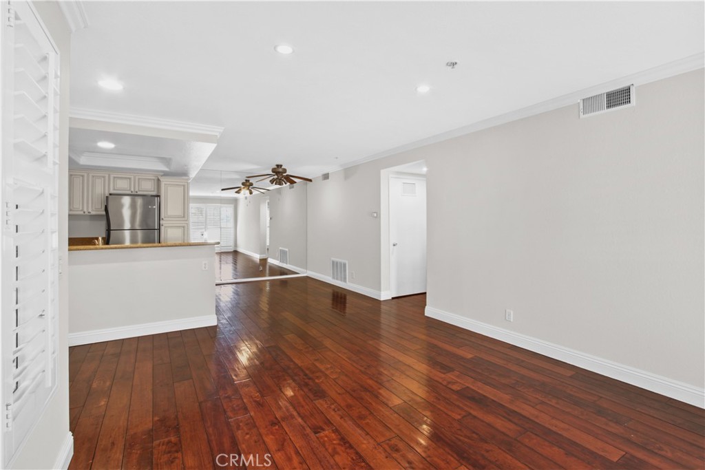 2800 Keller Drive, Unit 30 Tustin, CA 92782 - Photo 5 of 9 a view of a kitchen with wooden floor and a large window
