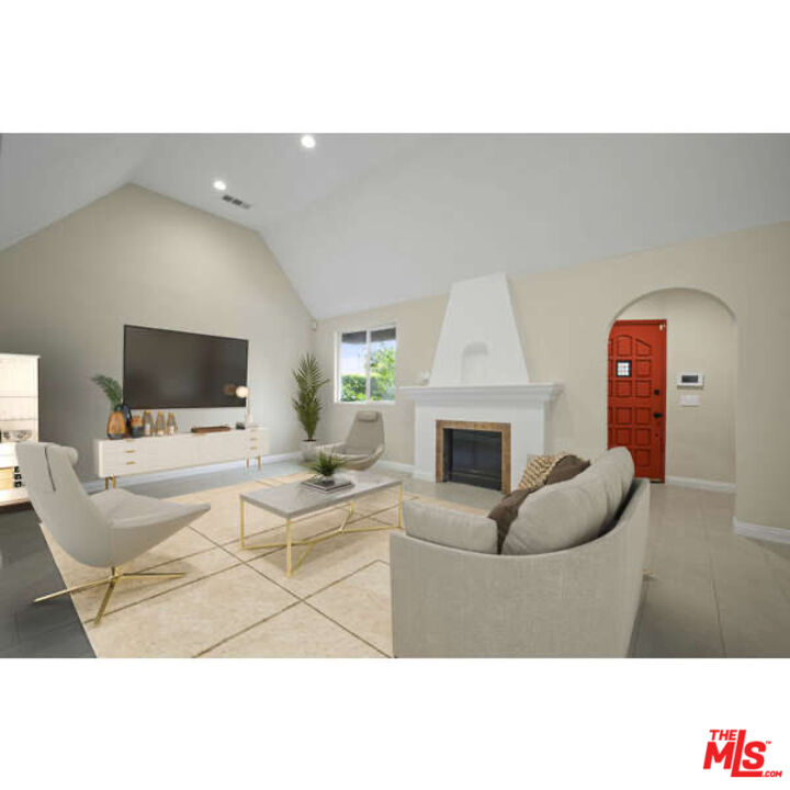 2148 Kelton Avenue Los Angeles, CA 90025 - Photo 2 of 36 a living room with furniture a flat screen tv and a fireplace