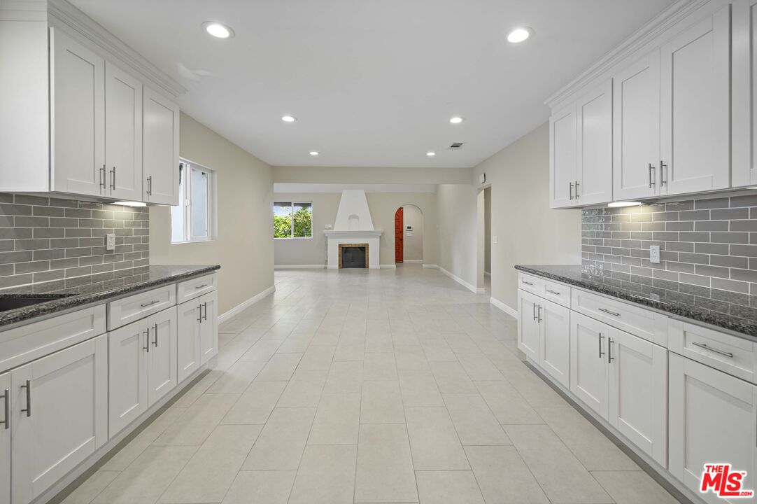 2148 Kelton Avenue Los Angeles, CA 90025 - Photo 9 of 36 a large kitchen with white cabinets