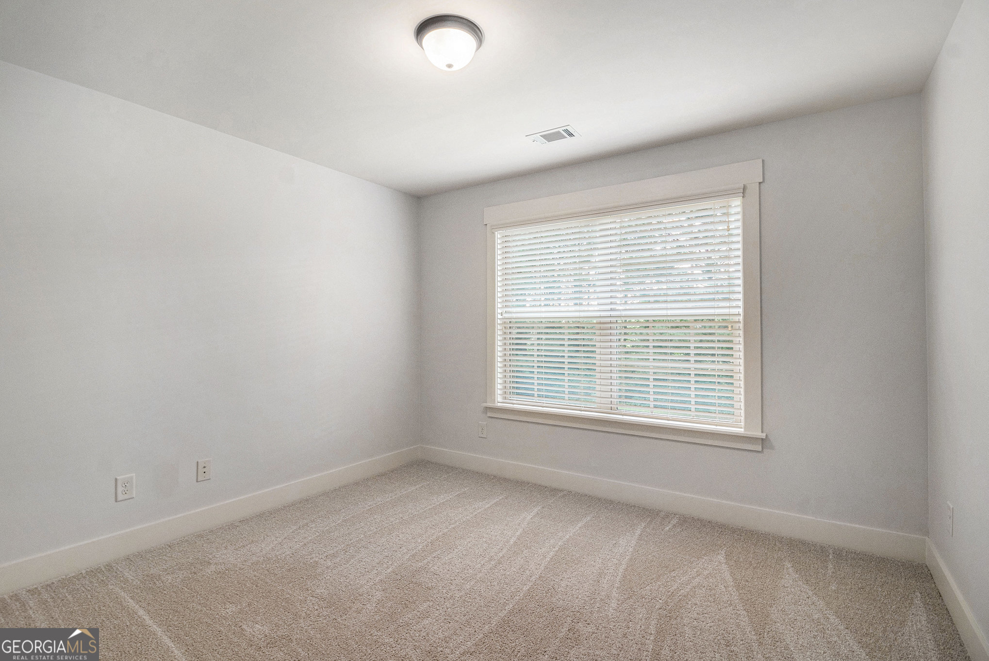 466 Austin Storey Circle Newnan, GA 30263 - Photo 17 of 38 an empty room with a window