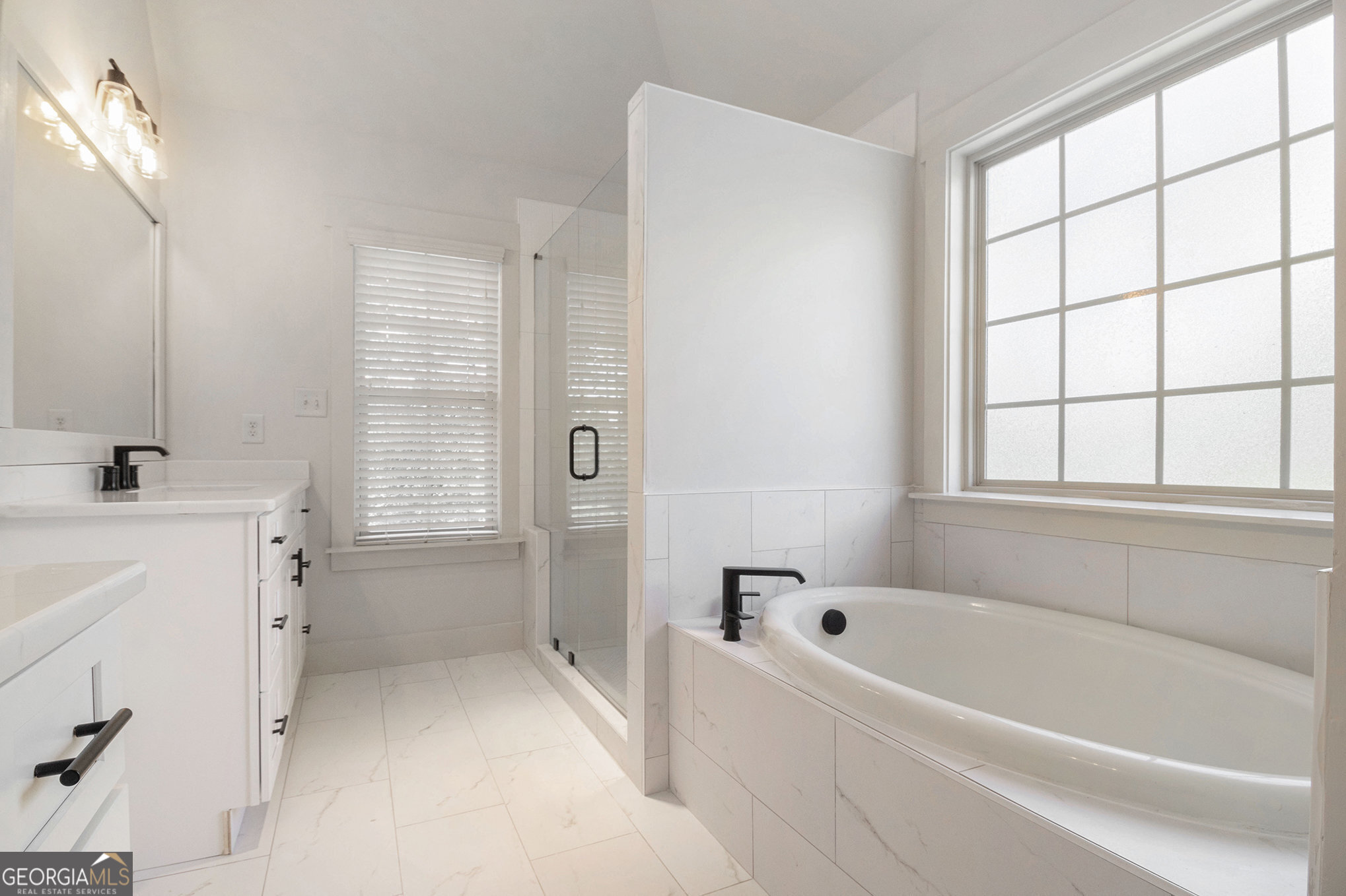 466 Austin Storey Circle Newnan, GA 30263 - Photo 23 of 38 a bathroom with a bathtub and a sink