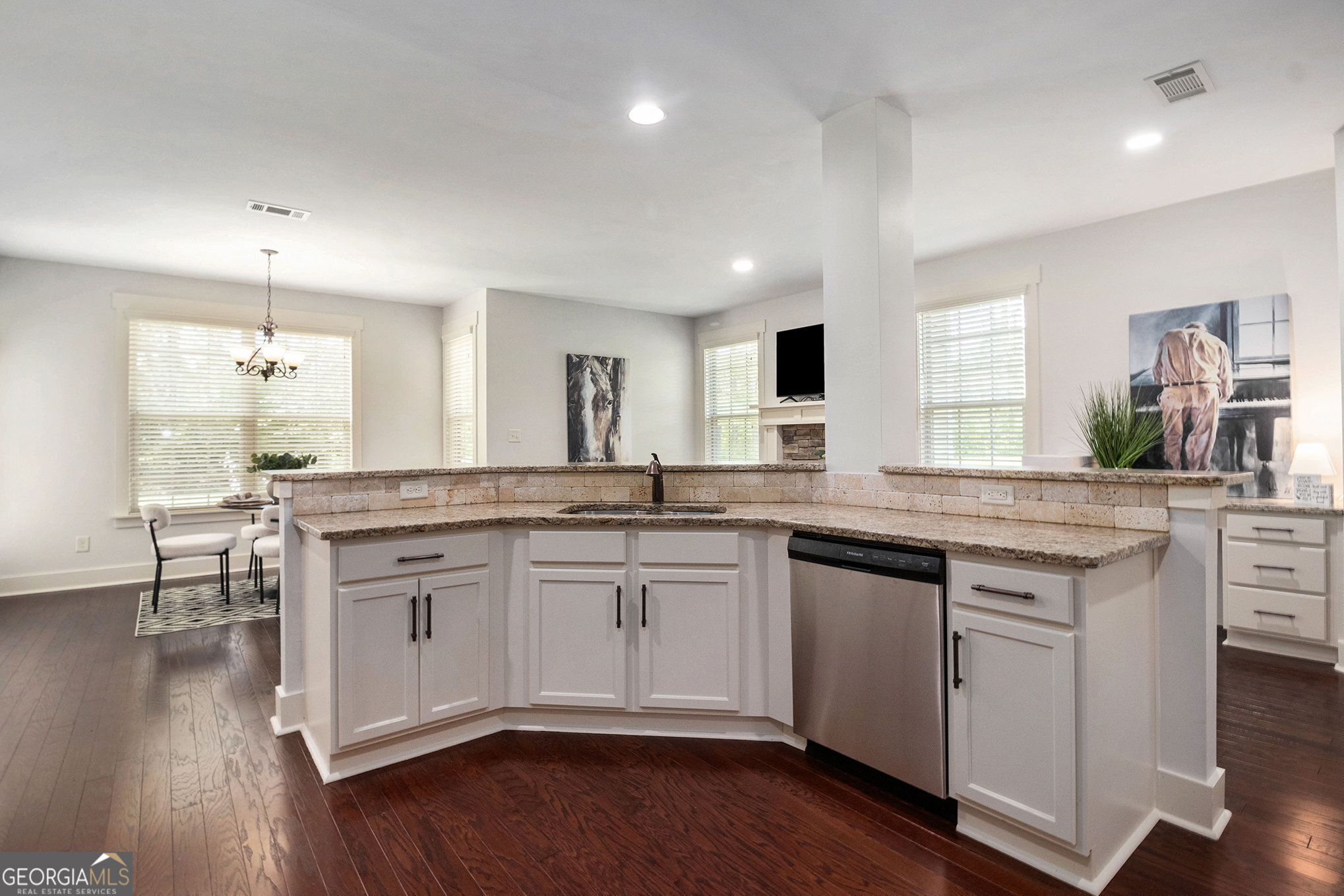 466 Austin Storey Circle Newnan, GA 30263 - Photo 6 of 38 a kitchen with a sink cabinets and wooden floor