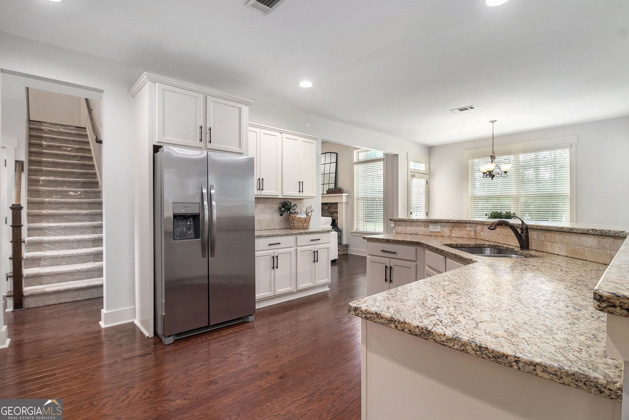466 Austin Storey Circle Newnan, GA 30263 - Photo 10 of 38 a kitchen with stainless steel appliances granite countertop a refrigerator a stove and a sink