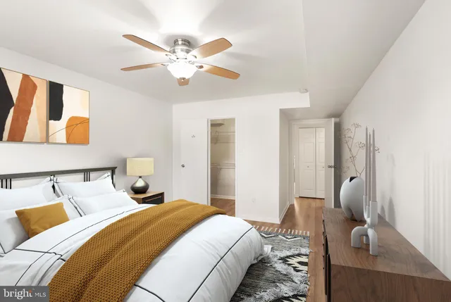 a work room with furniture and a flat screen tv