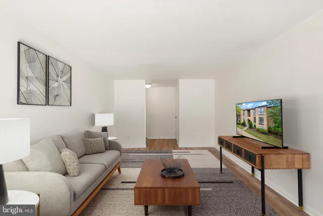 a living room with furniture and a chair