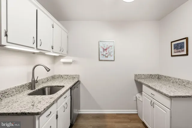 a kitchen with a washer and dryer