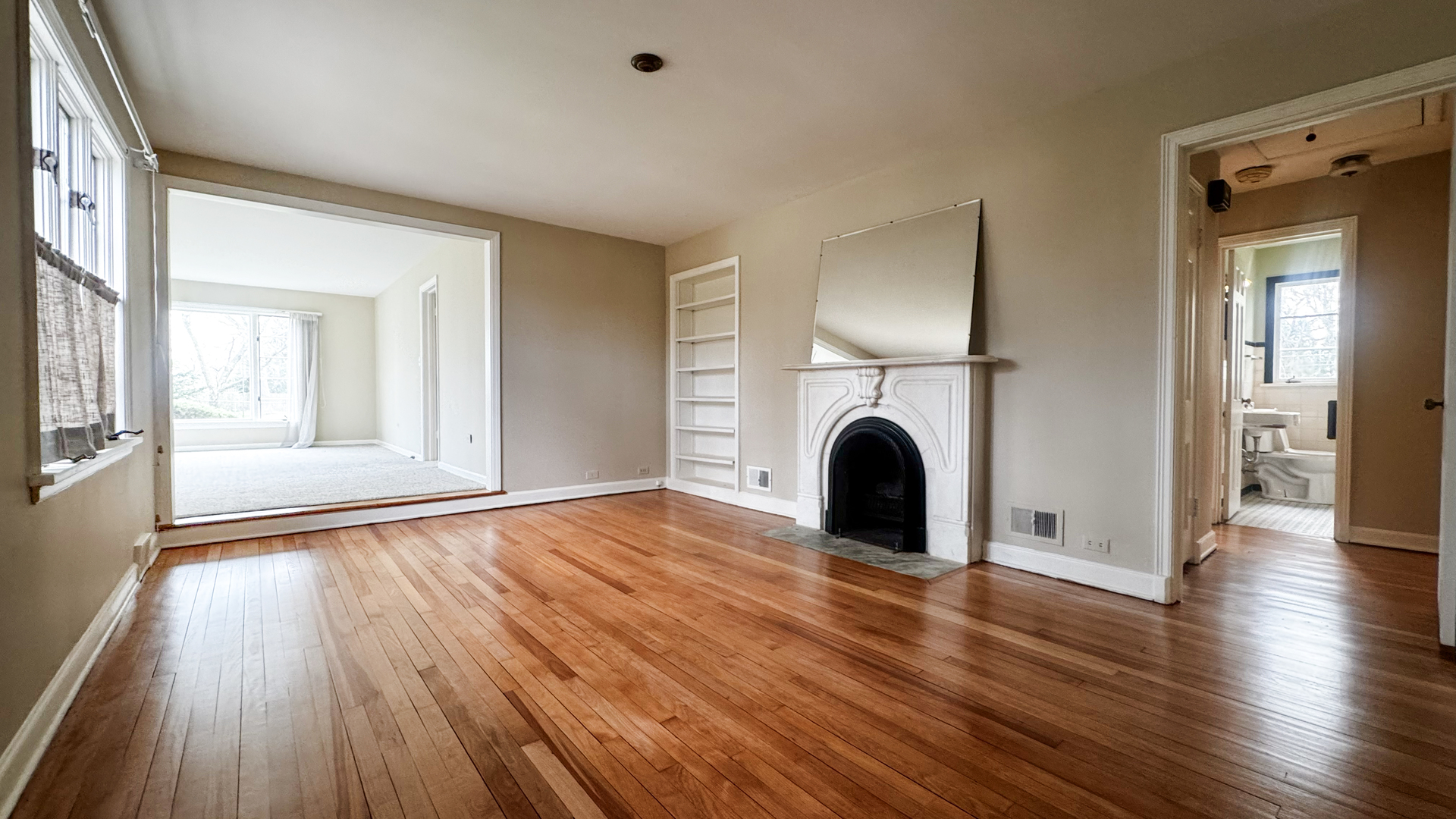 1848 North Sheridan Road Waukegan, IL 60087 - Photo 11 of 27 a view of livingroom with fireplace wooden floor and window