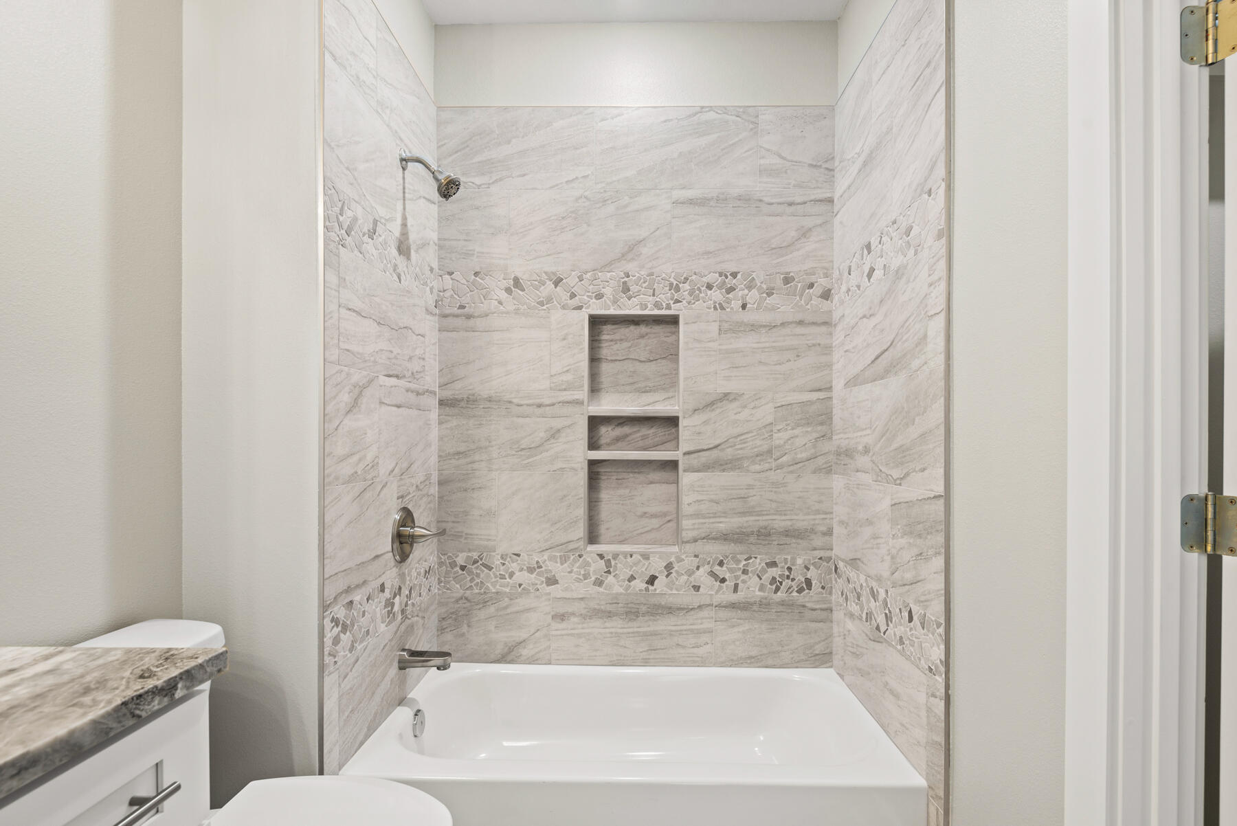 46 Winfield Street Niceville, FL 32578 - Photo 17 of 32 a bathroom with a granite countertop shower a toilet and a sink