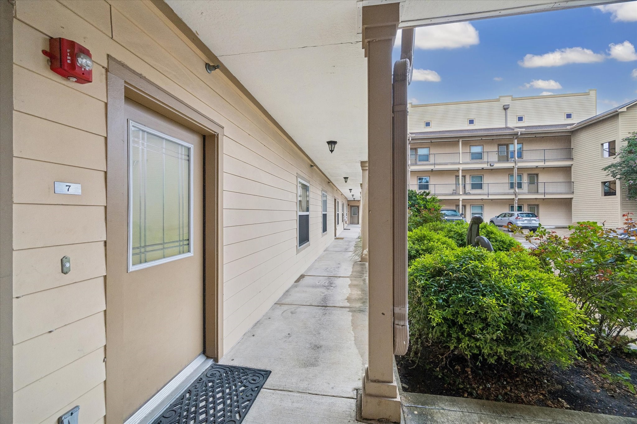3501 Chenevert Street, Unit 7 Houston, TX 77004 - Photo 16 of 21 Front door into the courtyard and gated parking lot with assigned parking spot.
