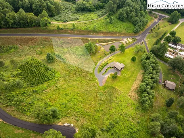 a view of a table and chairs in the garden