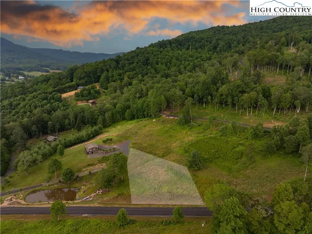a view of a lake with a yard
