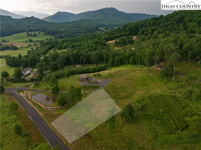 a view of a town with mountains in the background