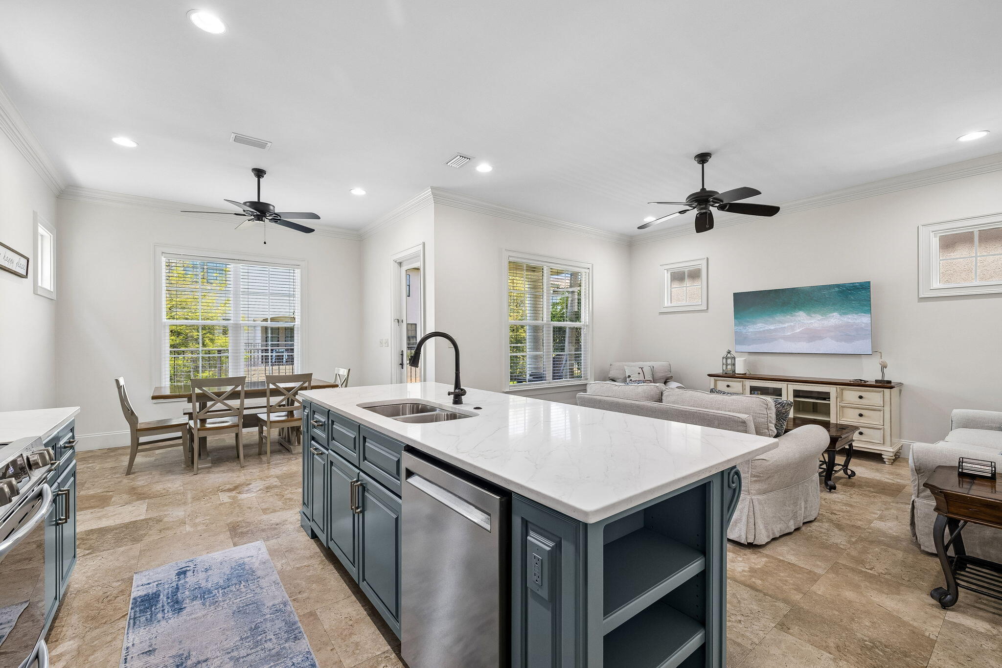 1973 Baytowne Loop Miramar Beach, FL 32550 - Photo 1 of 38 a large kitchen with kitchen island a sink table and chairs