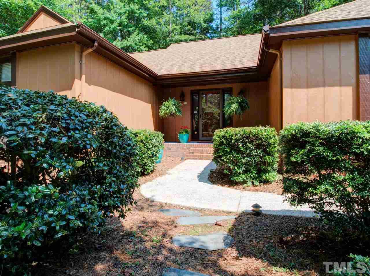 8316 Heel Stone Court Raleigh, NC 27613 - Photo 2 of 25 a backyard of a house with lots of green space