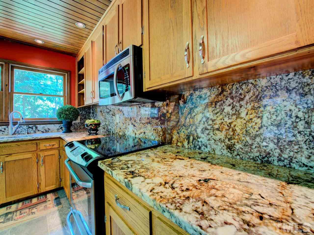 8316 Heel Stone Court Raleigh, NC 27613 - Photo 13 of 25 a view of a kitchen with a sink and cabinets