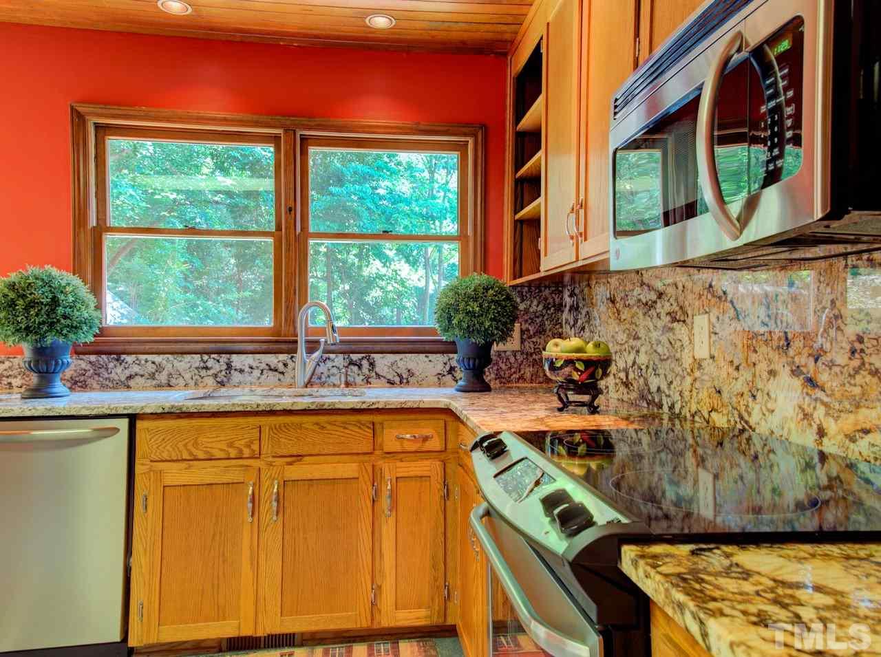 8316 Heel Stone Court Raleigh, NC 27613 - Photo 14 of 25 a utility room with stainless steel appliances wooden floor and a large window