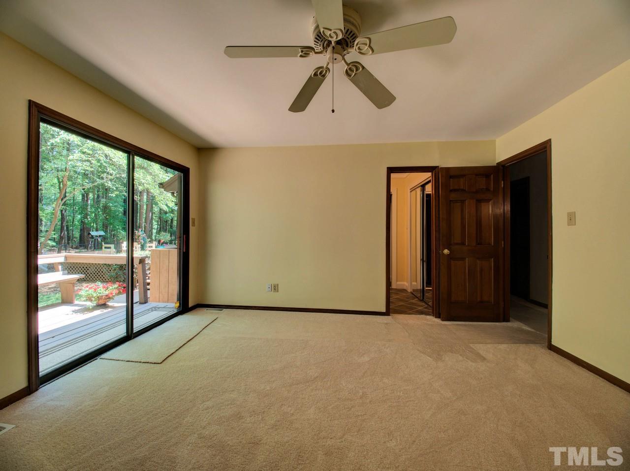 8316 Heel Stone Court Raleigh, NC 27613 - Photo 20 of 25 a view of a livingroom with a ceiling fan and window