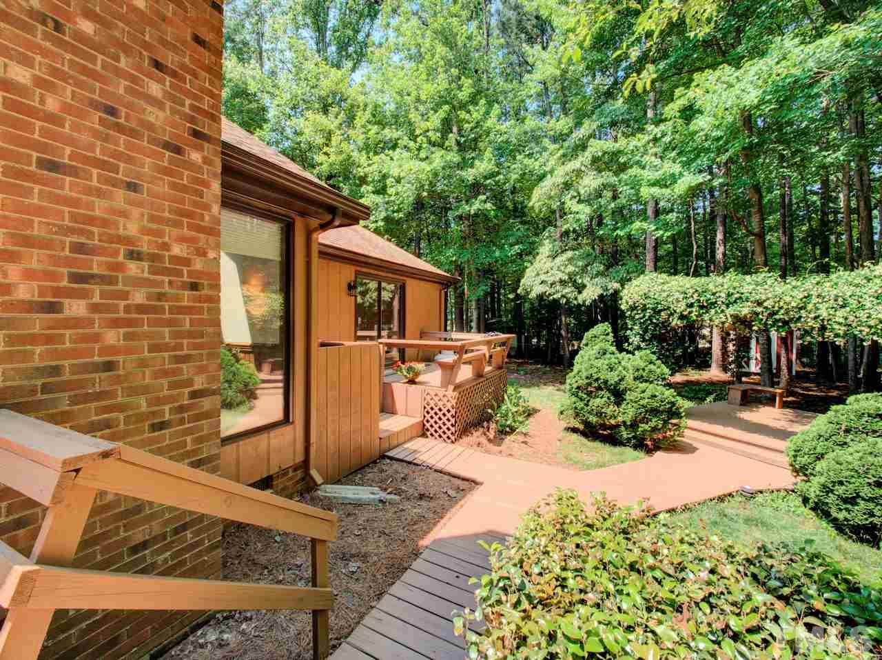 8316 Heel Stone Court Raleigh, NC 27613 - Photo 22 of 25 a front view of a house with a yard