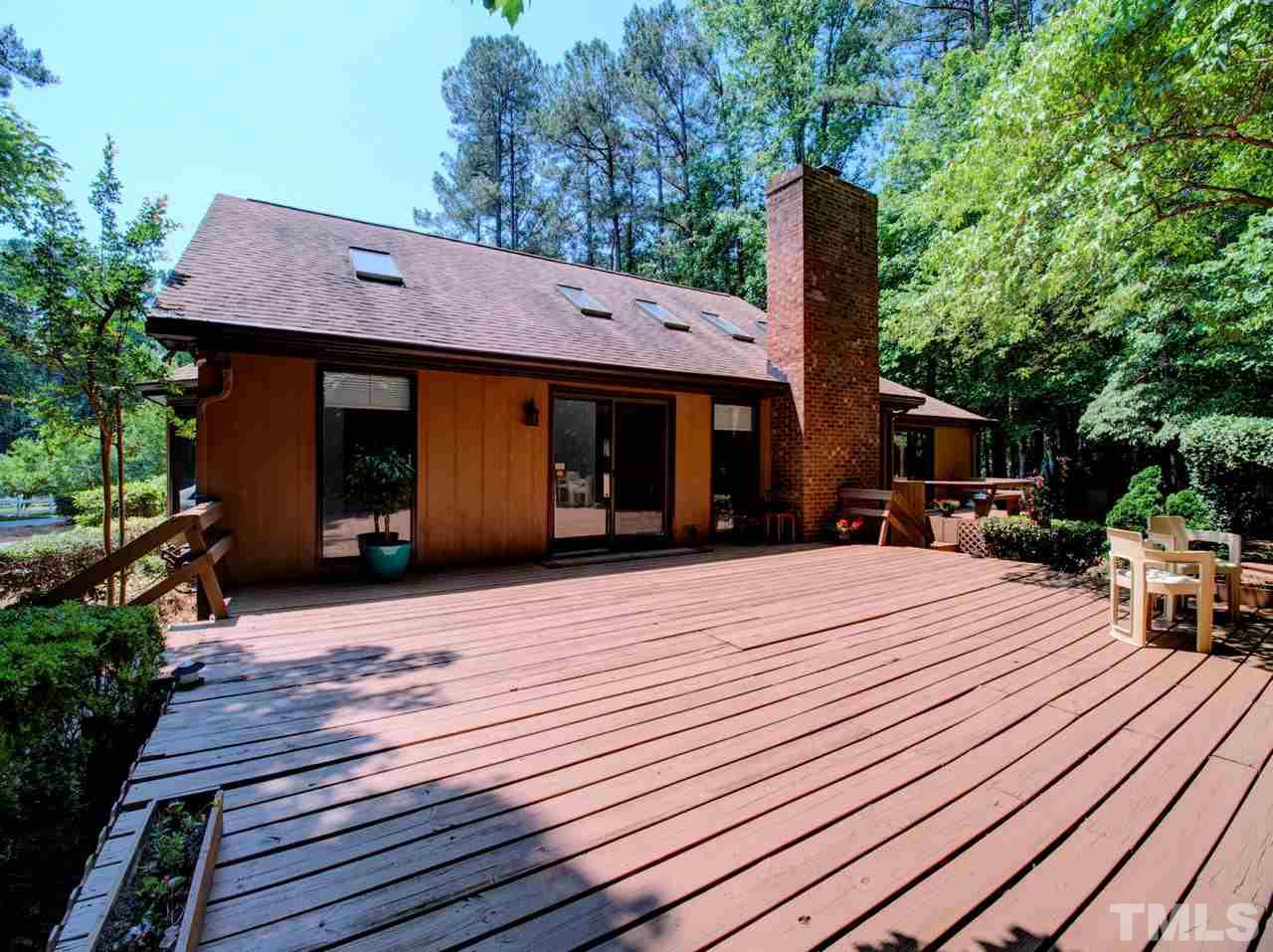 8316 Heel Stone Court Raleigh, NC 27613 - Photo 23 of 25 a front view of a house with yard and seating area
