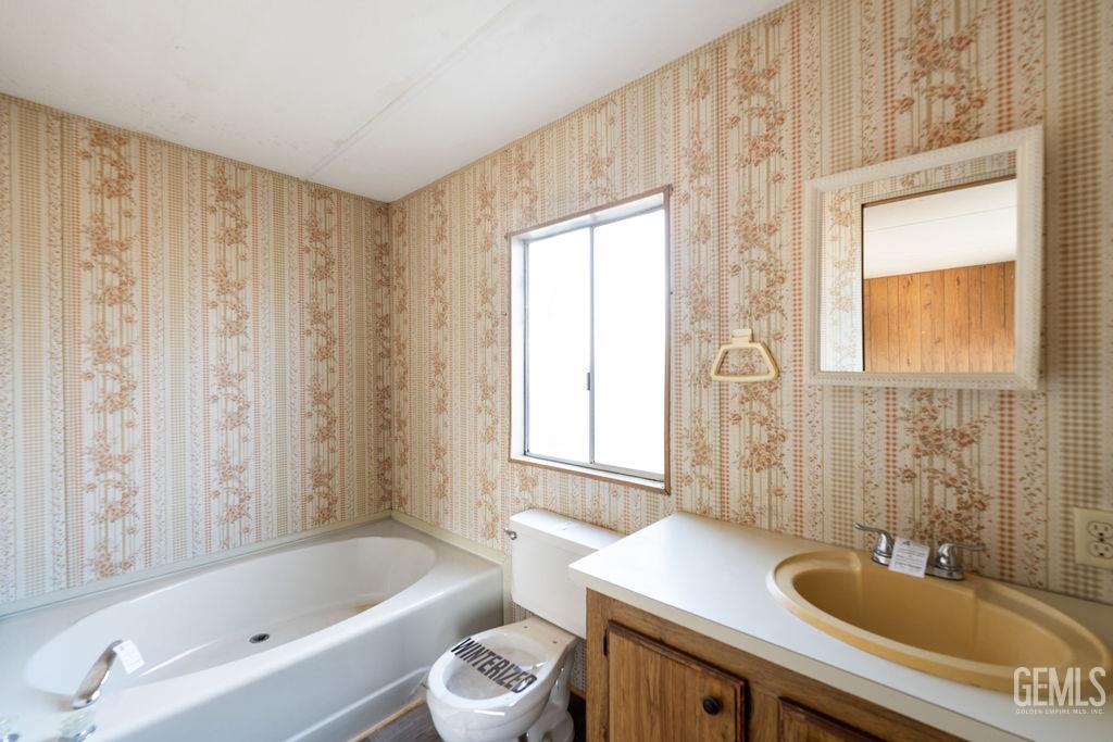 Undisclosed Address Bakersfield, CA 93313 - Photo 13 of 15 a bathroom with a sink a bathtub and a shower
