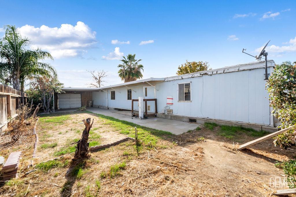 Undisclosed Address Bakersfield, CA 93313 - Photo 14 of 15 a view of a house with a yard