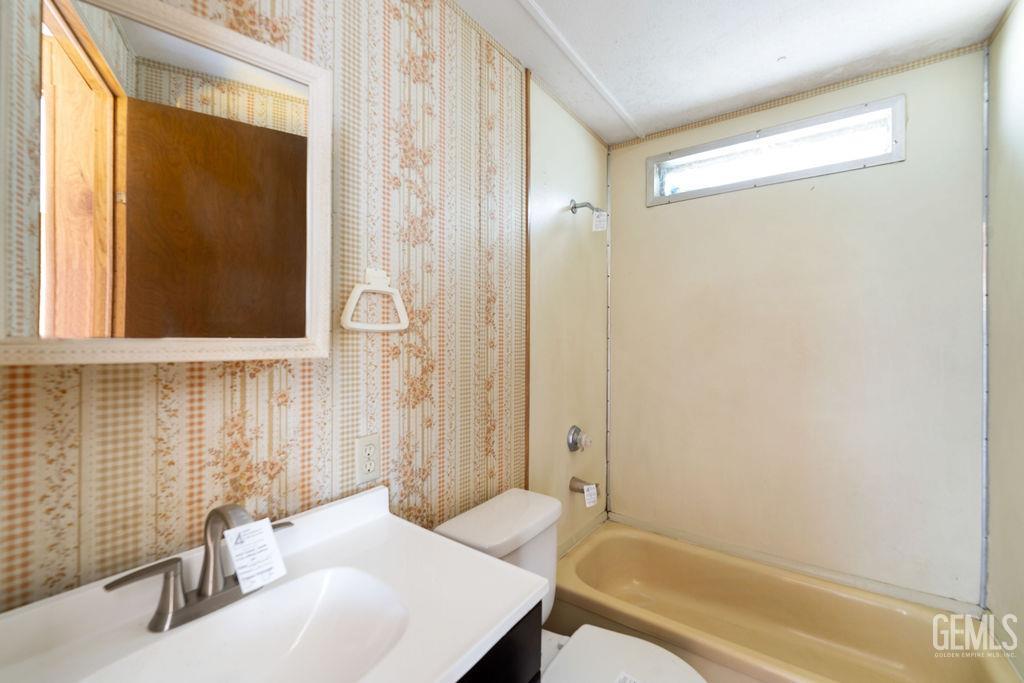 Undisclosed Address Bakersfield, CA 93313 - Photo 5 of 15 a bathroom with a sink and a bathtub
